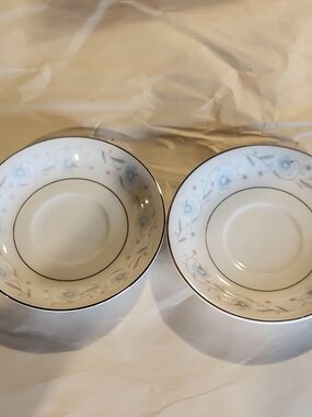 Elegant White Porcelain Saucer Set with Soft Blue and Pink Floral Trim